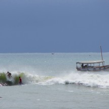 Surfers on the first beach of Morro de Sao Paulo